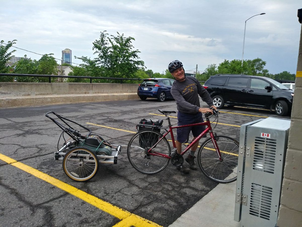 Did you know we have a bike trailer u can borrow? It's ✨FREE✨and one of our volunteers can show u how easy it is to hook up to your bike! This means u can bike over to the OTL and borrow larger items and transport them home easily. Check out Brian, borrowing a lawn mower! 😍🚲
