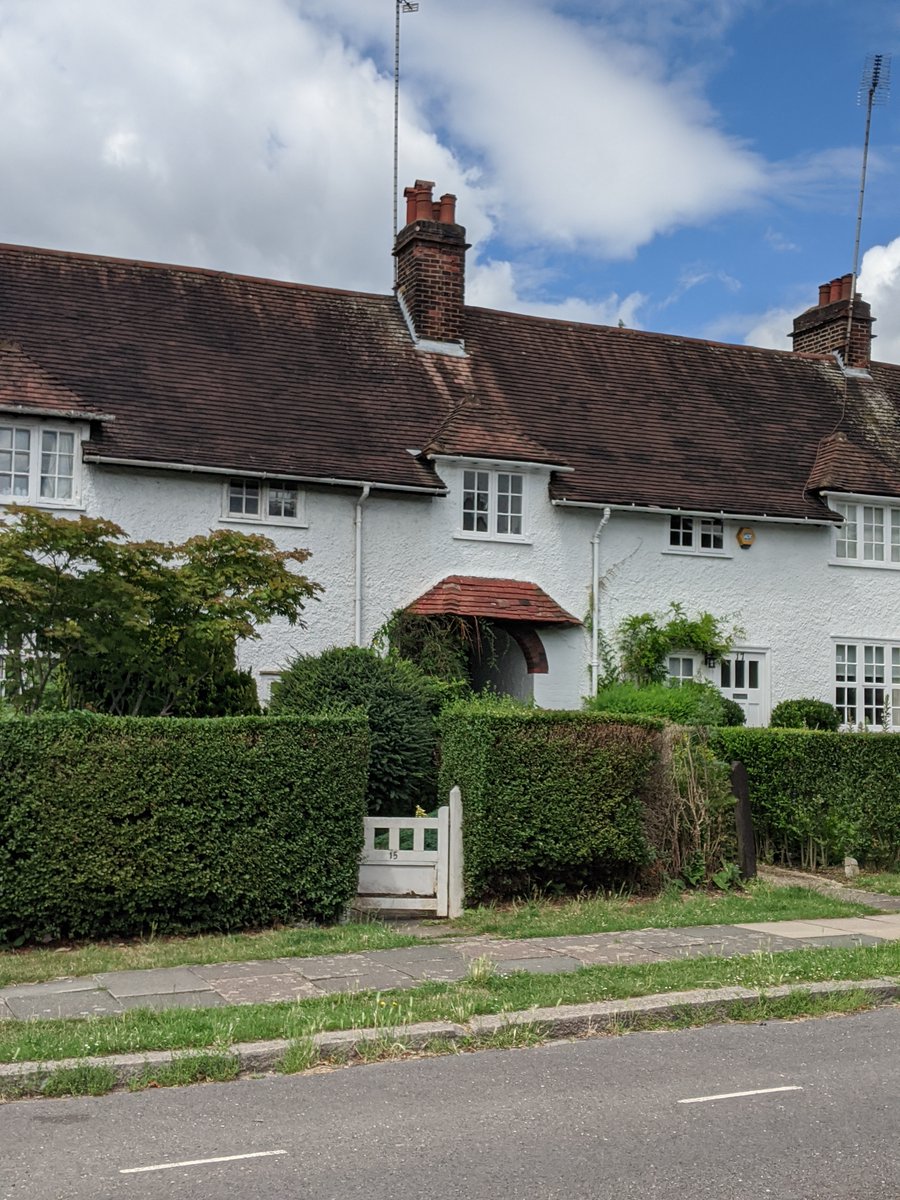 8/ Asmuns Hill has grass verges planted with fruit trees. Each house or pair of houses had a distinctive design.
