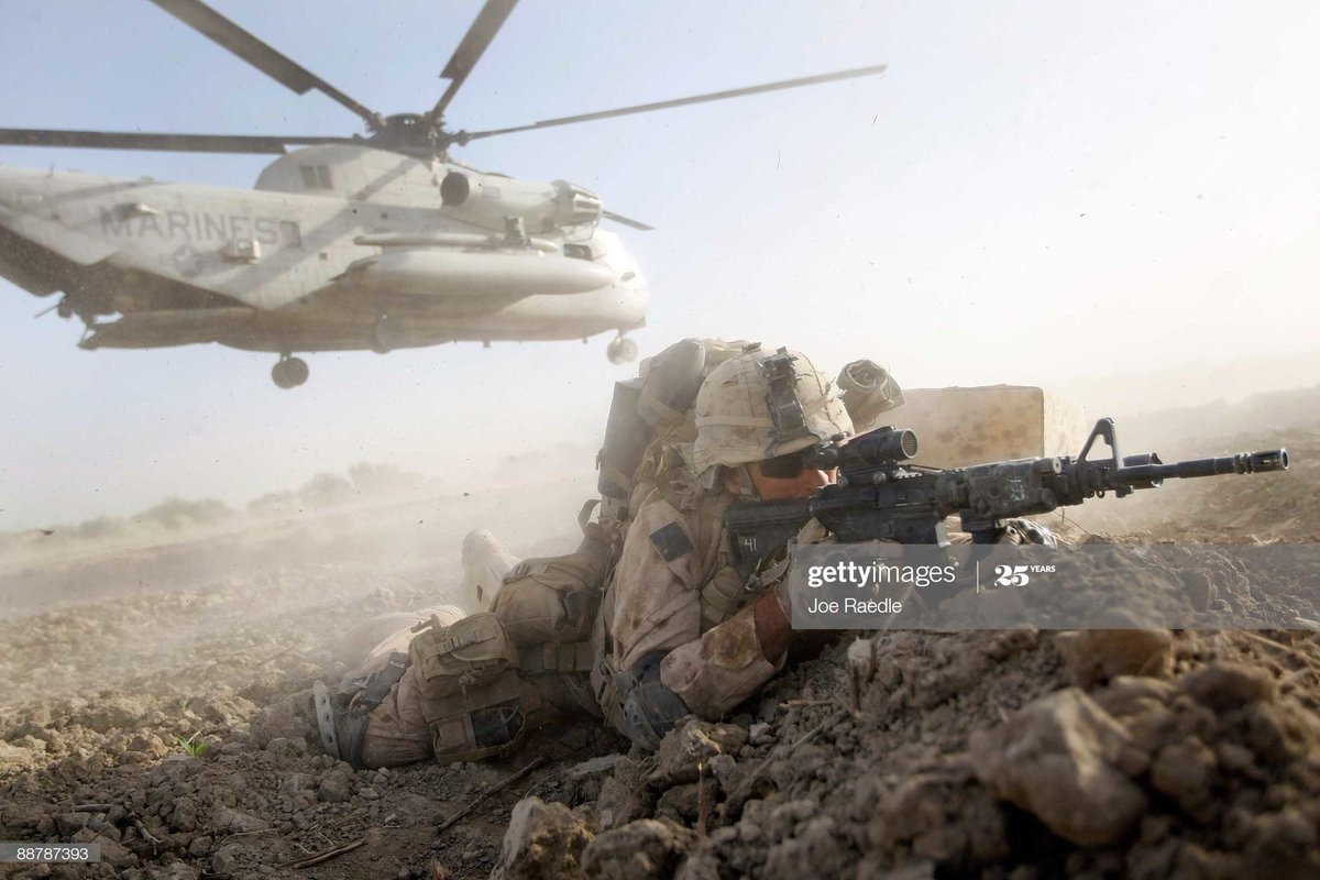 22. The gunfight ebbed and flowed from 7 a.m. to around 5 p.m., we began digging two-man fighting holes in the prone position with E-Tools. I remember thinking back to SOI that fighting holes were dumb and something out of WWI. I was wrong. Photo: Joe Raedle.