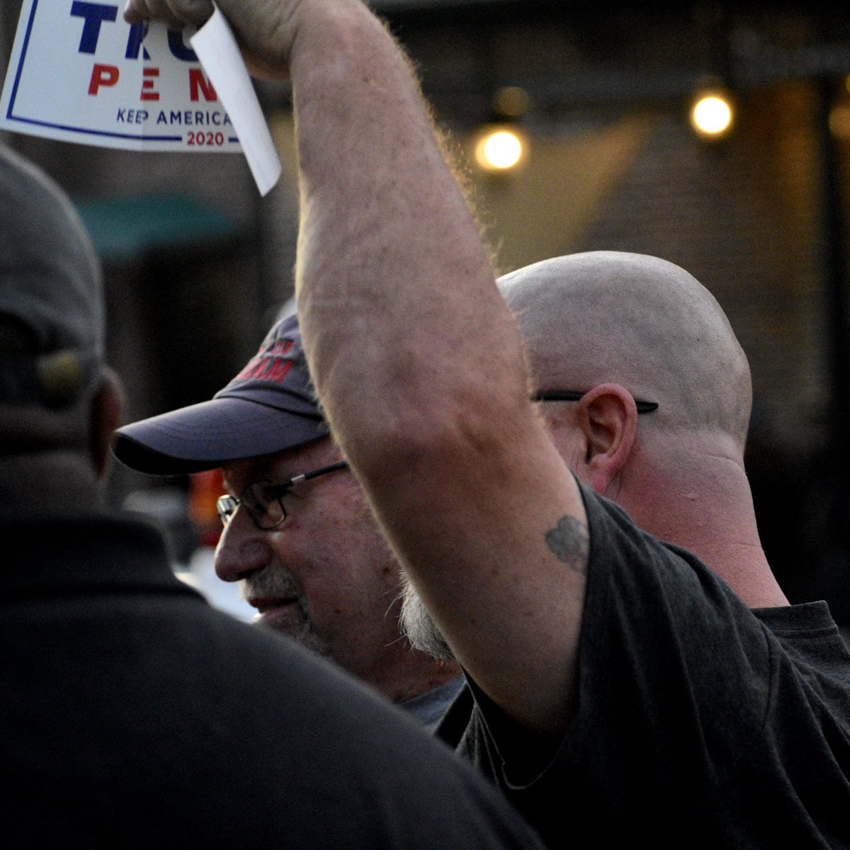 Immediately before, I was getting some pictures of Graham's mayor having a civil and civic conversation when "Batman" showed up and taunted the crowd with his Trump bumper sticker. I was surprised to be shoved but not as surprised as these two were to get arrested.  https://twitter.com/MeganSquire0/status/1274525582622162944