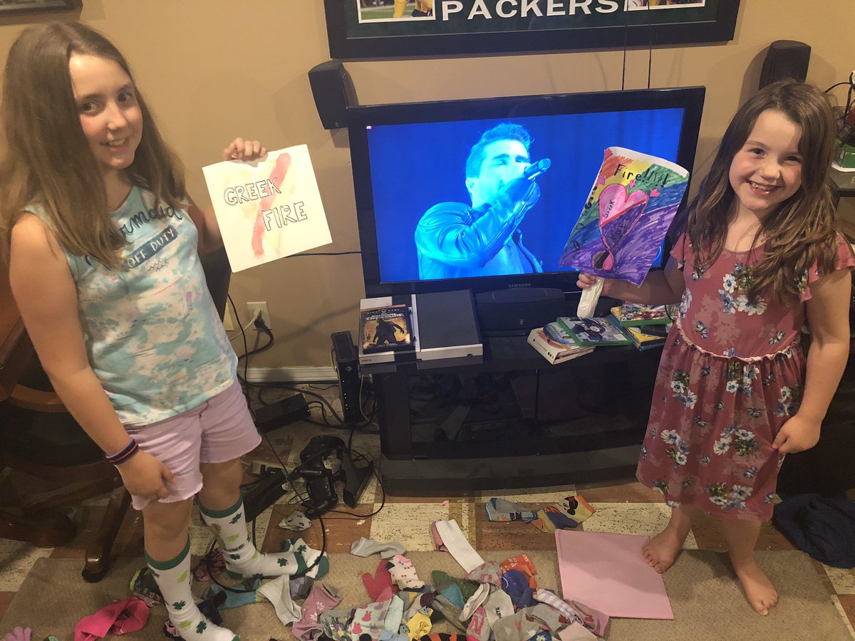 @greekfire livestream is awesome! My girls first Greek Fire concert, dirty socks and all! They even made signs for y’all. Rock and roll!!!