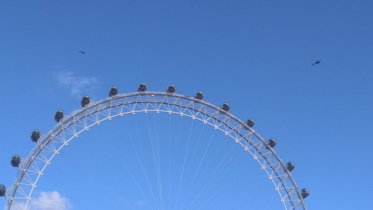 Lots of helicopters on the way back, dozens of police vans and hundreds of police. We learned later that there were some demos, but clearly were in the Trafalgar Square area before they arrived. &ndash; bei  River Thames