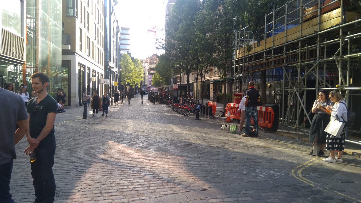Lots of pockets of people drinking take-away drinks in Soho, this photo taken on the junction of Berwick Street and Broadwick Street.