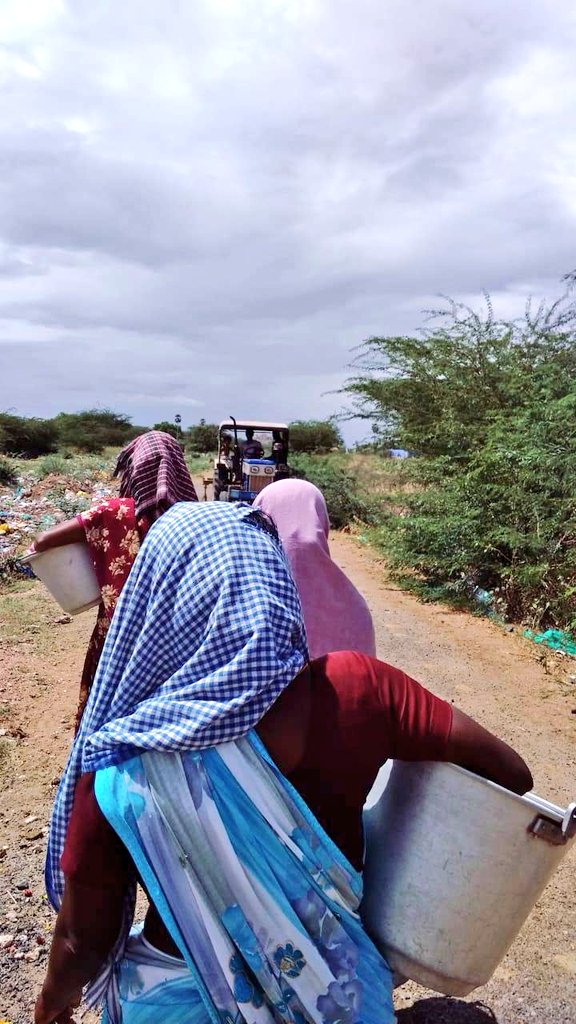 On the way to the pond... LM is in jamun colored saree. I am grinning because this way the first time, I was allowed to step out in my tee without getting nagged to change into something 'decent'Towels on head as my village is really hot even in winter.