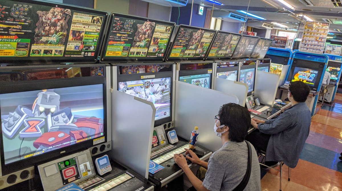 ESLGuiltyGear's tweet photo. We went to HEY arcade in Tokyo's Akihabara. It's great to see arcades are making it work. They just started up about 2 weeks ago and crowds were good! People were on the machines in the Guilty Gear section and competition was still fierce! https://t.co/MANcYiH7aC