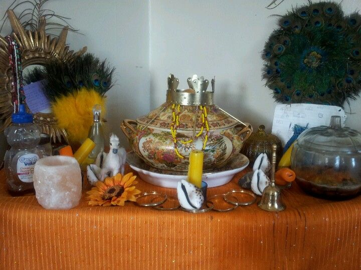 The reason why we don't use statues to venerate the orishas is because the orishas have provided a tool for connecting with them - consecrated shrines. This picture of an Oshun altar has all the accoutrements but the most important is that pot in the middle. That's Oshun.