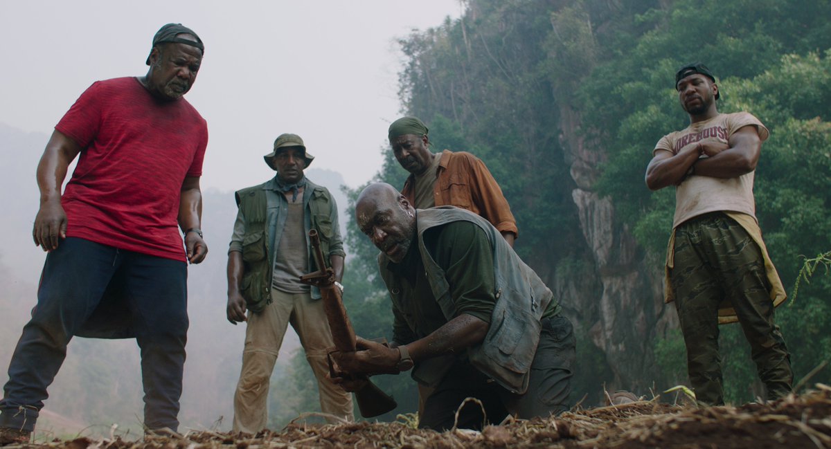 In DA 5 BLOODS, four war buddies Otis (Clarke Peters); Eddie (Norm Lewis); Melvin (Isiah Whitlock Jr.); and Paul return to present-day Vietnam to recover the body of their fallen brother Stormin’ Norman (Chadwick Boseman) and a cache of buried gold bars.