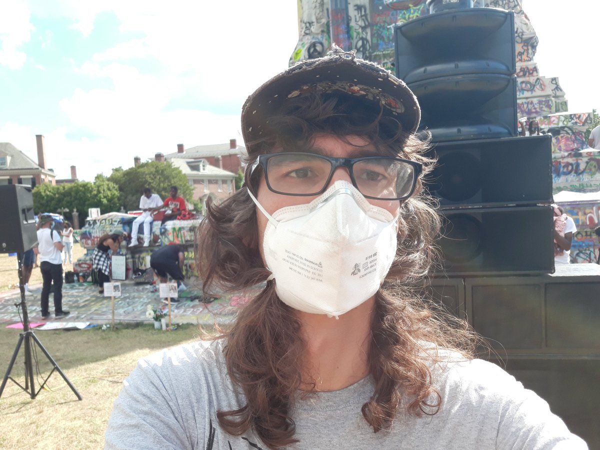 I am at the graffiti covered Lee statue in Marcus-David Peter Circle in Richmond, Virginia. I got my mask on and I am experiencing the activities here on this Juneteenth weekend. It& #39;s been 24 straight days of political action in town.