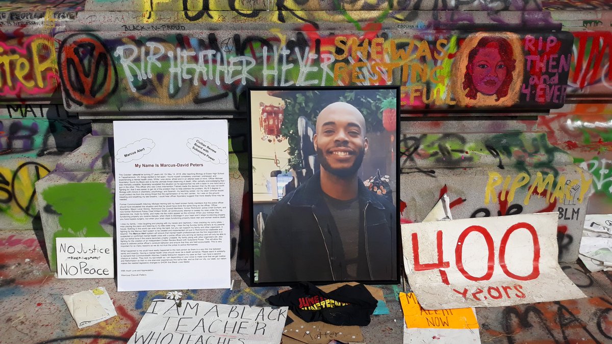 This is who the circle is now dedicated to. Marcus-David Peters was shot and killed by a police officer during a mental health crisis. Above his picture is a mention of Heather Heyer who was killed by a fascist in Charlottesville.