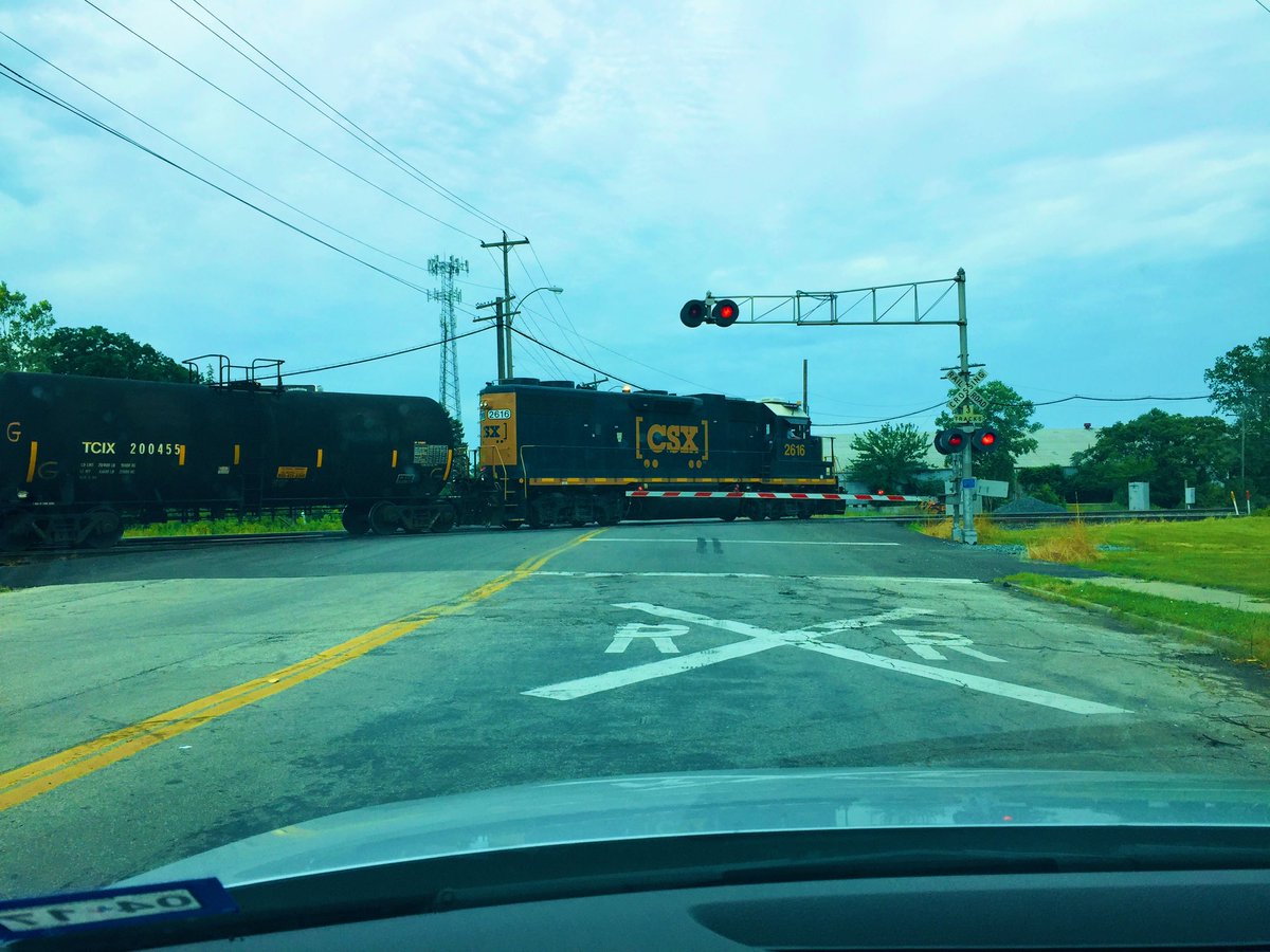 22/6/17 & I was finally over my hangover. Picked up coffee and donuts from a downtown Toledo hipster place that was playing The Smiths, and had breakfast by a cloudy Lake Erie, then headed off to Chicago, held up briefly by a proper old school level crossing on the edge of town.