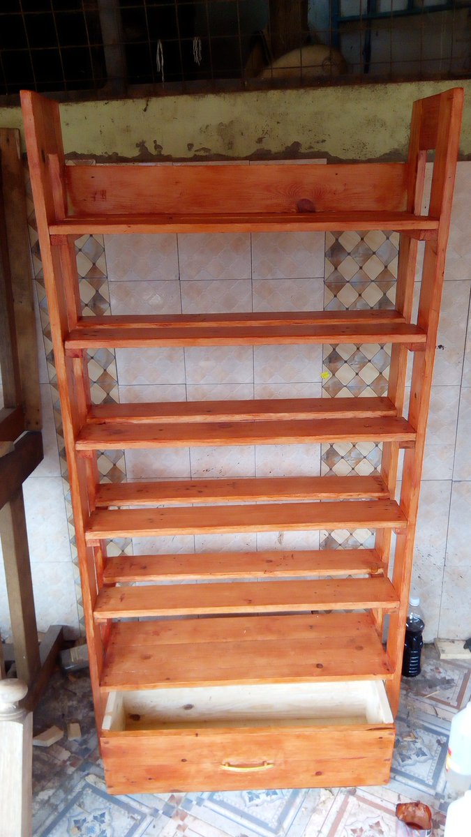 A shoe rack with a drawer