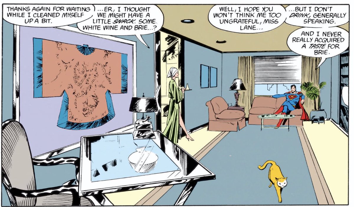 Lois Lane’s modern 80s apt. Glass desk. Cat. Not sure what the art is. Lois rocking the bathrobe-and-heels combo, which your mileage will vary on. But notice how Superman doesn’t like brie cheese? Kinda wonder if that’s a misguided macho thing on Byrne’s part. Brie is delish.