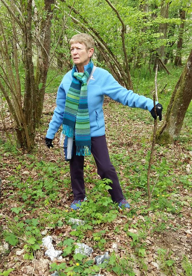 In 2017, just before the discovery of Canty, Don's daughter visited Normandy. She'd been into the field where her dad died but not into the woods. The grey stuff by her feet is wreckage from her dad's plane. /13