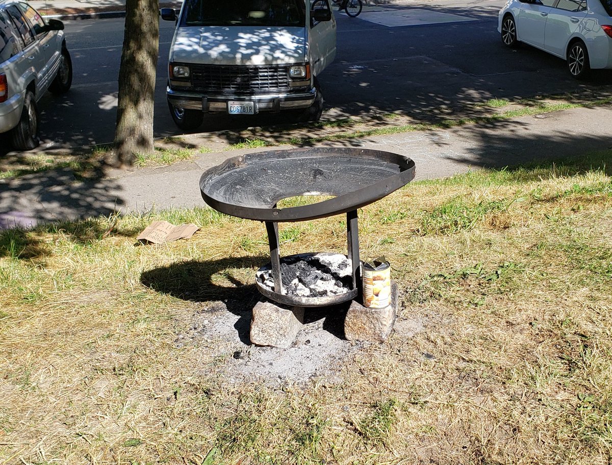CapHillCitizens's tweet photo. Today's lovely view. #CHOP 'protesters' now using trash can lids as BBQ's. Have seen multiple burnt areas around the park. The vandalism continues at Cal Anderson Park. #seattleprotest #CHAZ #chazchop https://t.co/1OEA1qFSJm