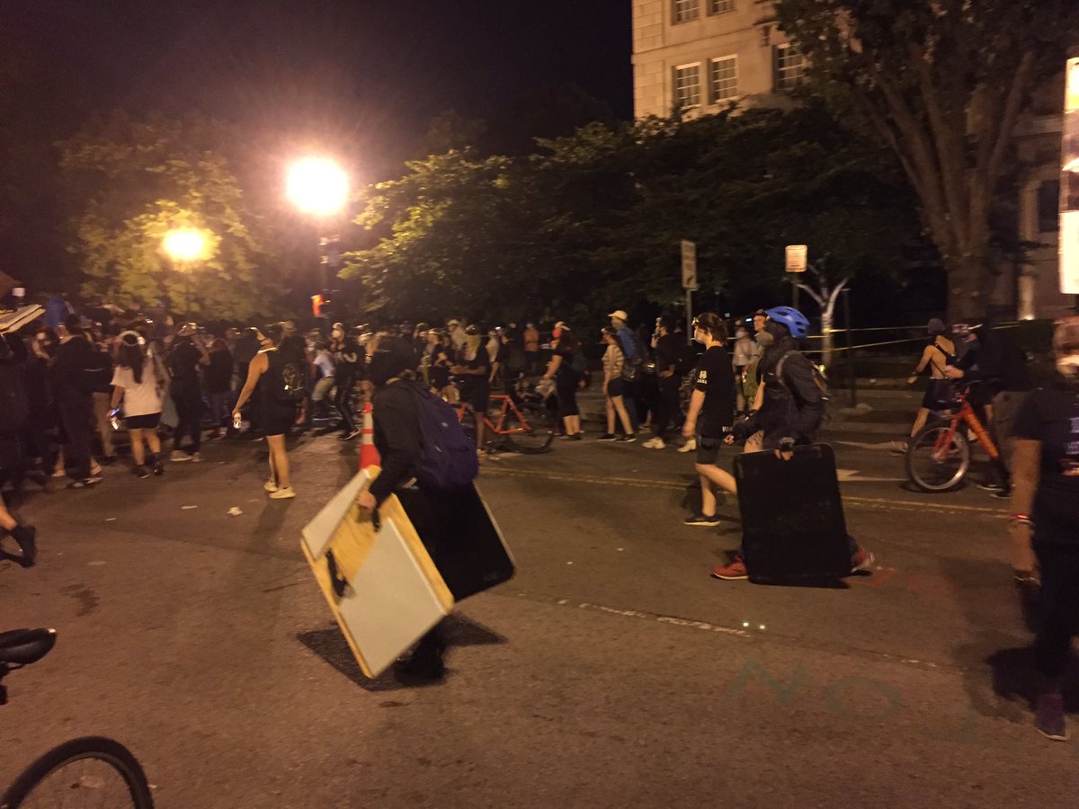 Just saw a group of protesters walk up to the line with big wooden shields