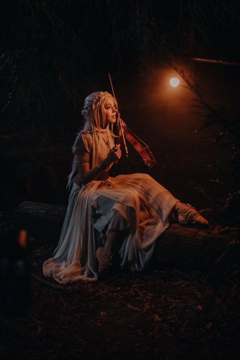 LindseyStirling's tweet image. New music video tomorrow #BetweenTwilight. Sign up for the premiere here: found.ee/LS_BetweenTwil… and come dance in the woods with me and @derekhough
