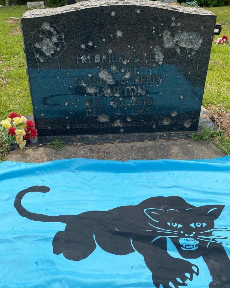 J0hnnyXm4s's tweet image. TIL it’s tradition for local police to visit and shoot up Fred Hampton’s grave. Here is his son visiting it for Fathers Day.