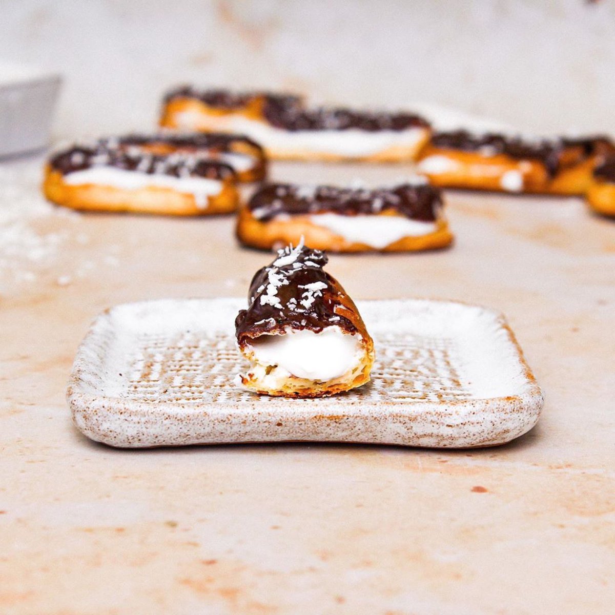 coyo_uk's tweet photo. Do you remember when veganism was stigmatised for being boring and "nothing but salads" 🥒🥬🙄
Well, to prove just how far we have come, we proudly present 🥁 VEGAN CHOCOLATE AND COCONUT ECLAIRS! 
Recipe on our Instagram page to celebrate #nationaleclairday 
#vegan #chocolate https://t.co/iTjlA28Io6