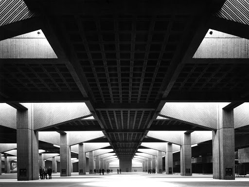 8. Place Bonaventure (1964-7) in Montreal. This is *the* great sixties megastructure - a vast corduroy concrete block, not easy to photograph (so less famous than Habitat) - with a train line running through it, and a dreamlike sequence of interior spaces of piranesian vastness.