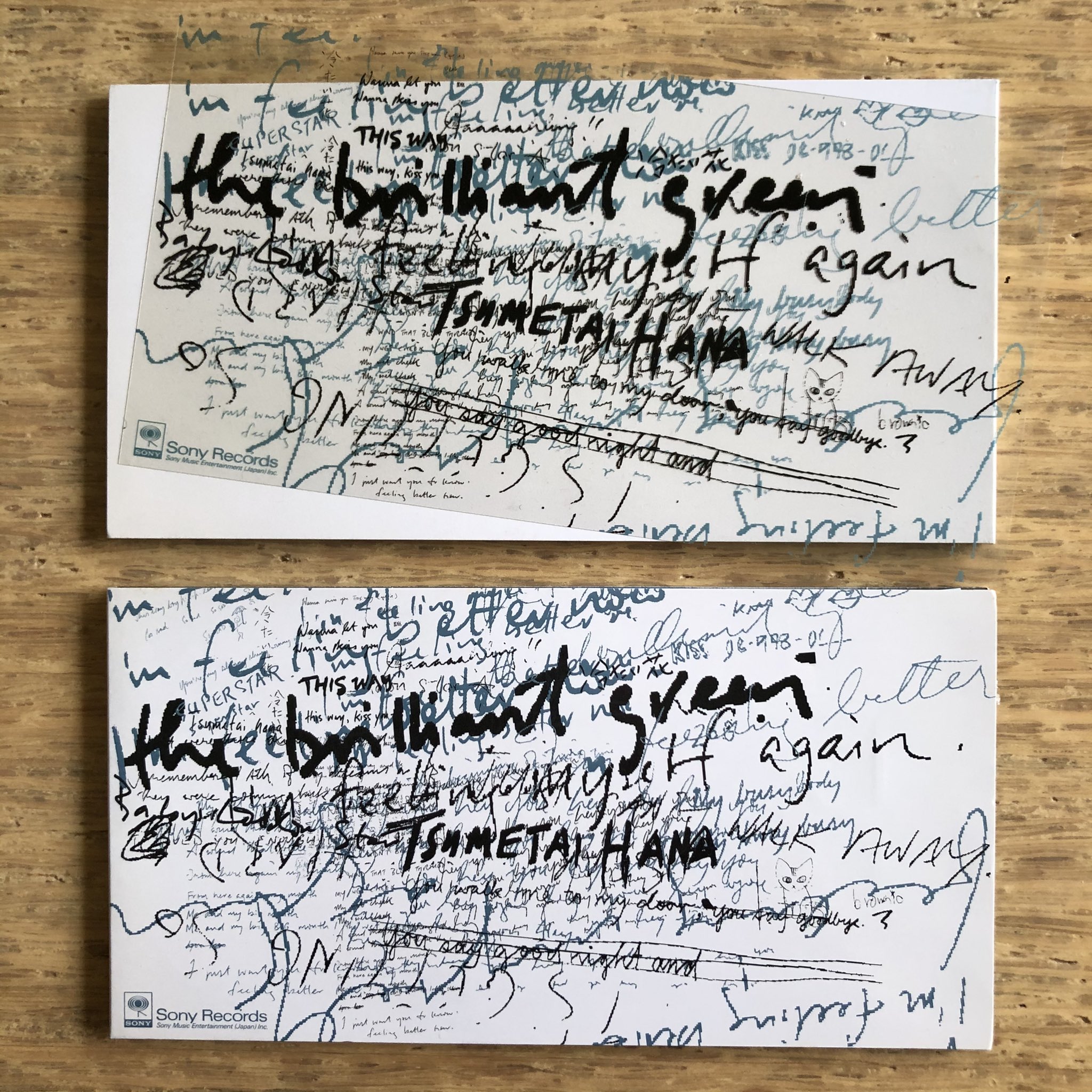 Nakamura8cm 間違い探し8cmcd 冷たい花 The Brilliant Green 1998年8月26日発売の4thシングル 上が初回盤 手書き文字を印刷した透明フィルムが白ジャケに乗せられている 通常盤は同じデザインがジャケに直接印刷されている ところで00年の再発盤全然見