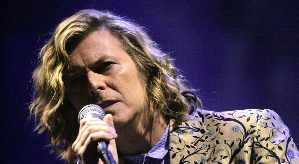 I was backstage with David and bandmates ready to perform at Glastonbury in '00. David looked out at the quarter of a million fans. There was something about that day that made me feel like it'd be the most powerful concert ever in Glastonbury history. Photo: Toby Melville 1 / 7