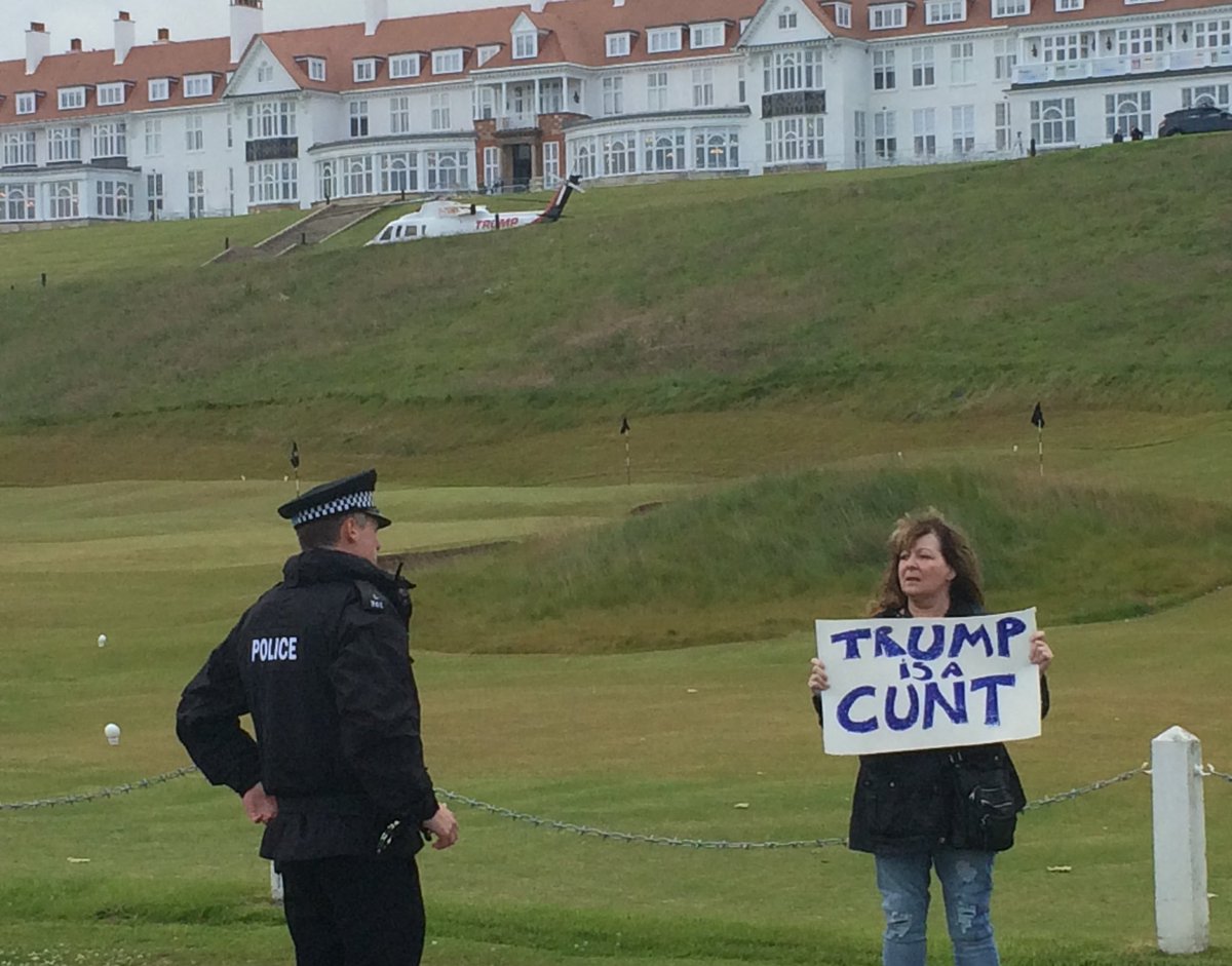 Four years ago today, I stood at Turnberry with a sign that even the cops couldn’t argue with. As Trump exited his helicopter in the background and I stood firm. I was on Scottish Land ( the pavement)  not Trump property so they couldn’t move me. #happyturnberryanniversary