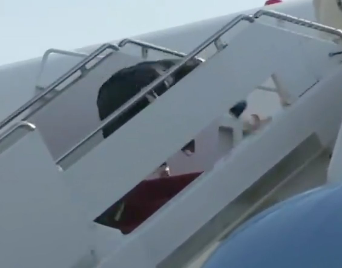 4/ When he's two or three steps from the top, Pence falls (if you look carefully, this occurs when he shifts his eyes from the steps to the plane entrance).Pence breaks his fall first with his left hand, then with his right.