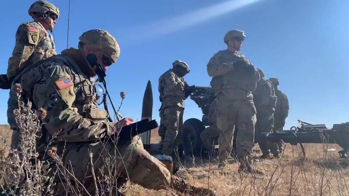 Fire for effect! Cannon crew members work the howitzer cannons that