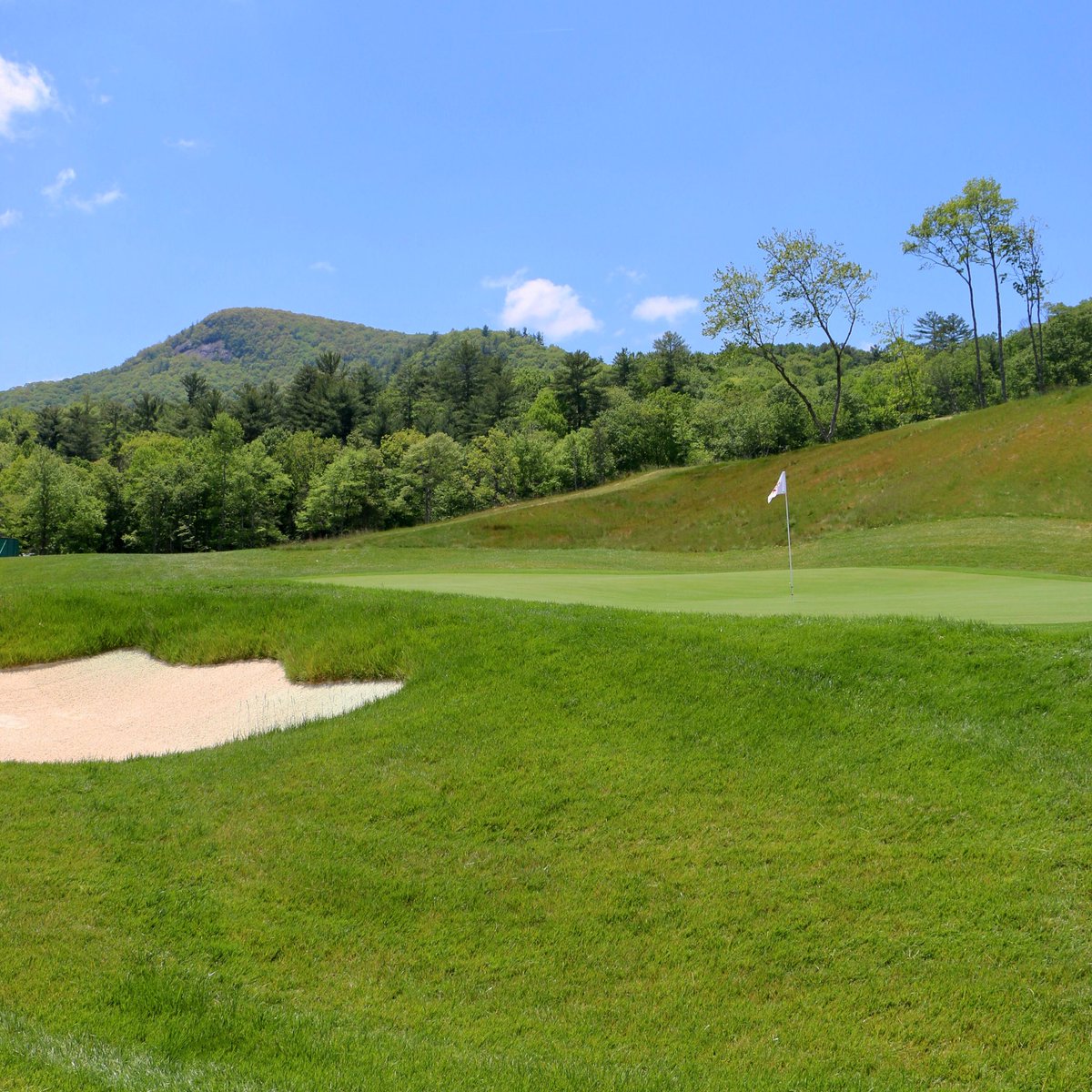 Picturesque views of Shortoff Mountain from The Saddle’s 12th green. 

We love this 12-hole par three course that we designed to anchor the new GlenCove by Old Edwards lifestyle and wellness community in Cashiers, NC.