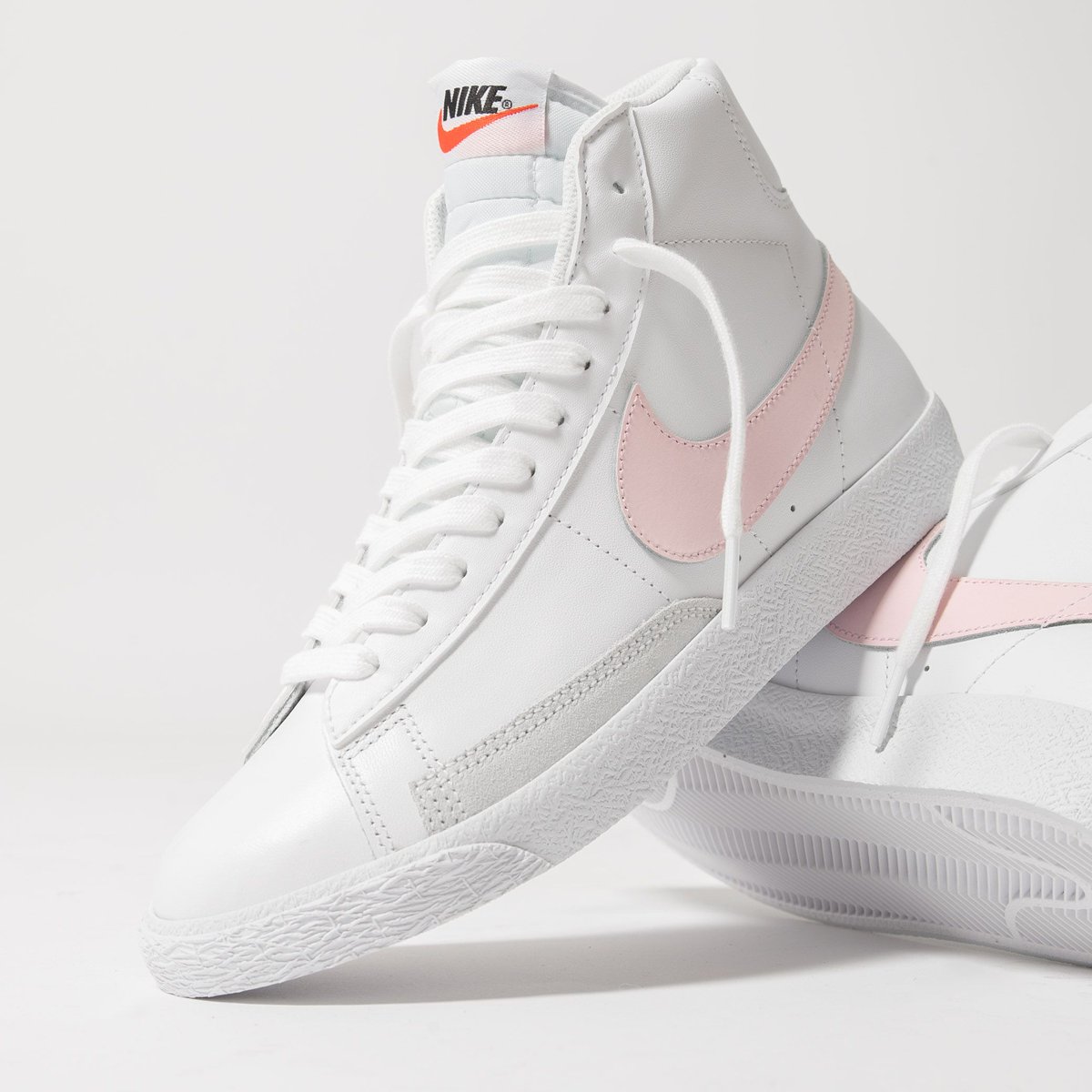 white nike with pink check