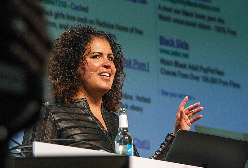 Currently,  @safiyanoble is an Associate Professor at the University of California, Los Angeles (UCLA) in the Department of Information Studies[Image of Dr. Noble used under creative commons attribution-share alike 2.0 Generic license, from re:publica via Wikimedia Commons]