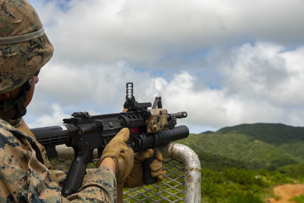 USPACOM's tweet photo. U.S. @PacificMarines with Combat Logistics Battalion #CLB31, @31stMEU train with an #M203 grenade launcher during a weapons familiarization course on Range 7 in Okinawa. #SemperFi #BOOM #Lethality #FreeandOpenIndoPacific. https://t.co/tuR1aulKvB