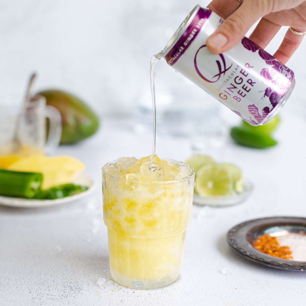 Spicy Mango Moscow Mule with muddled jalapeño, chilled vodka, fresh mango purée, lime juice and a hefty pour of refreshing <a href="/Qmixers/">Q Mixers</a> Ginger Beer --> onearmedmama.com/2020/06/spicy-… #recipe #cocktail #ad