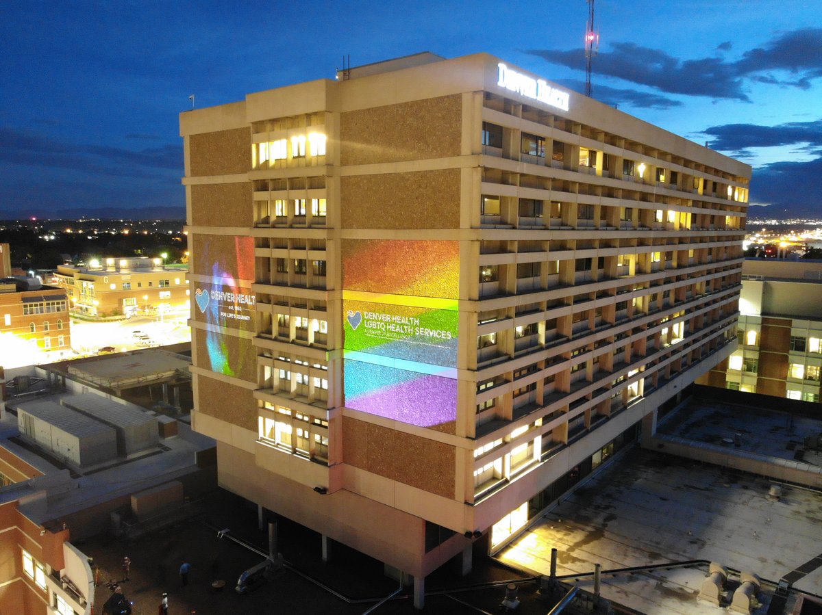 DenverHealthMed's tweet photo. The rainbow flag was loud and proud last weekend as we were honored to project it across one of our hospital buildings in support of #Pride! Denver Health proudly stands with our #LGBTQ+ patients and community while providing a welcoming place for everyone. @DHParamedics #DHPride https://t.co/38RNAfAR2O