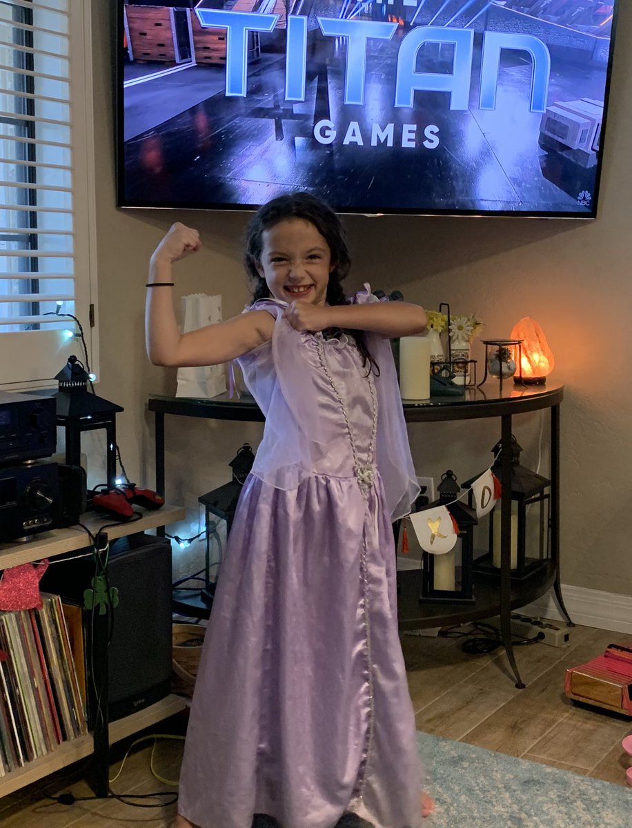 PromoGirlJaime's tweet photo. Watching @nbctitangames with @TheRock with this firecracker. Love that she’s in a princess dress showing her muscles. She loves this show and has ‘started her training.’ ❤️ #stronggirl #titangames @cravenpunkdj https://t.co/woONxOSv6D