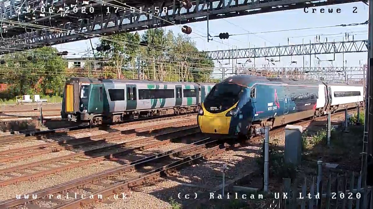A @LNRailway #Class350 passes an @AvantiWestCoast #Class390 with newly applied livery, seen on @railcamlive Crewe cam 2. #spottingfromhome