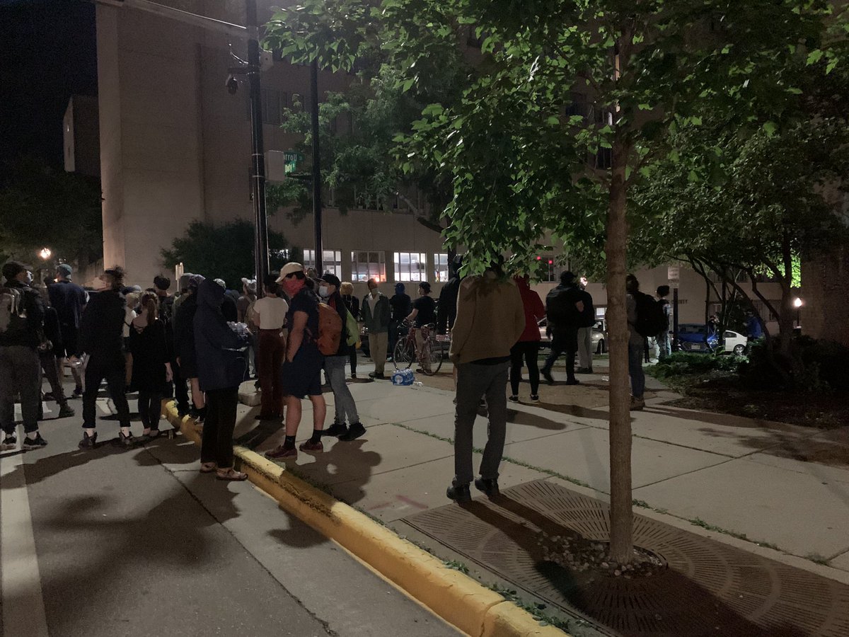 Protesters just lit a garbage can on fire and something inside of a window of the Madison Police Station. Fire inside the window was very small. Hard to see in photos.