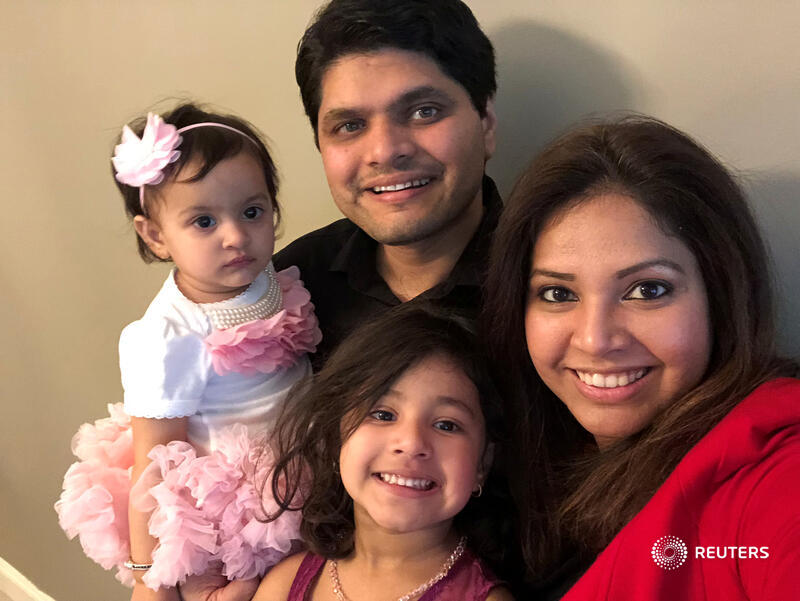 Reuters's tweet photo. A new immigration order issued by President Donald Trump that bars the entry of holders of certain temporary work visas has left nearly 1,000 people trapped in India, separating several families until at least the end of the year https://t.co/xFTVSKbOsw via @micarosenberg https://t.co/kmzoqrmlGm