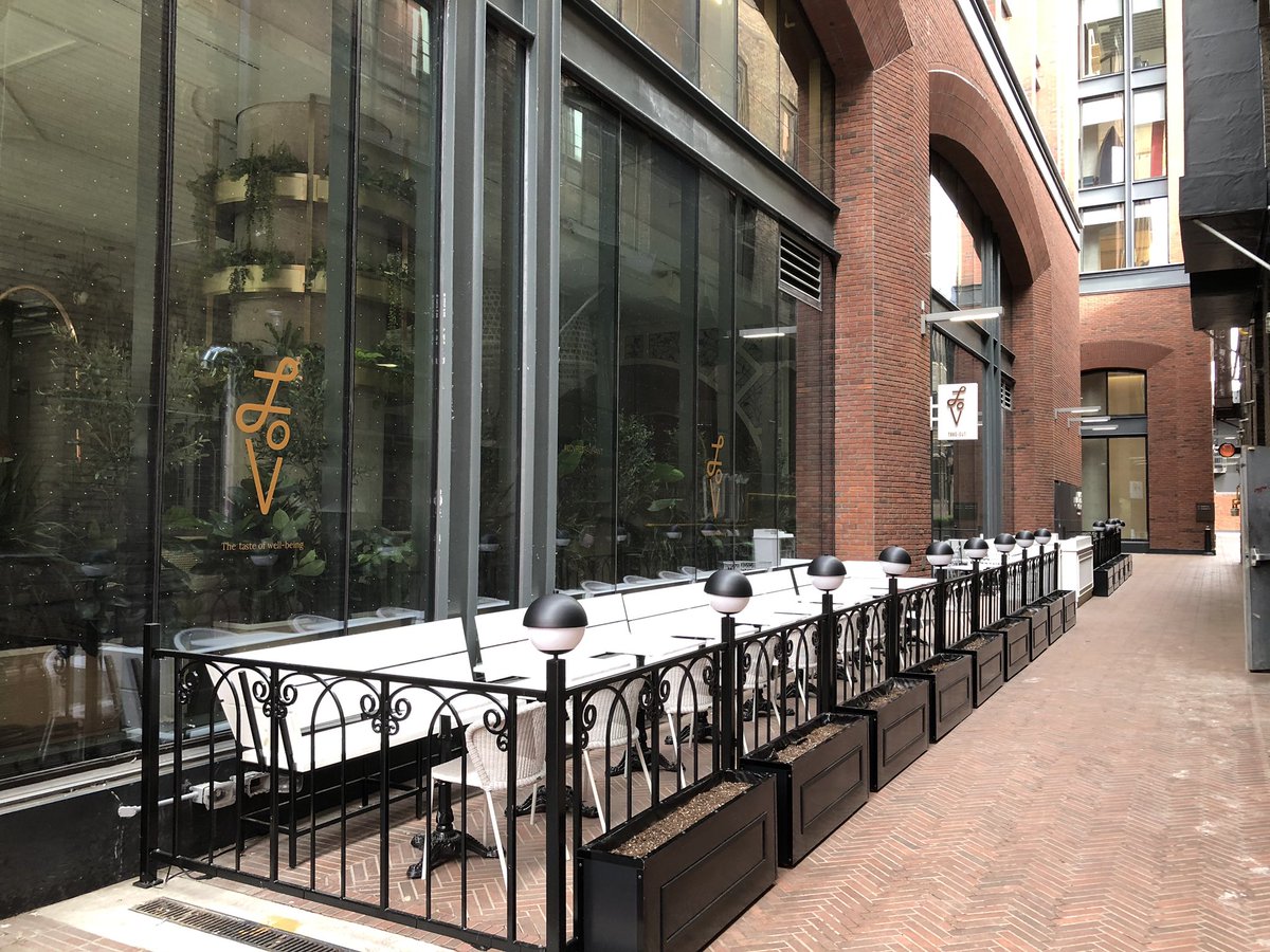 along king street west — many restaurants are setting up for patio season after months of pandemic restrictions. pictured here: LoV restaurant with a large side patio & Ruby Soho.  https://www.thestar.com/news/gta/2020/06/24/barber-shops-hair-salons-restaurants-malls-and-patios-reopen-in-toronto.html