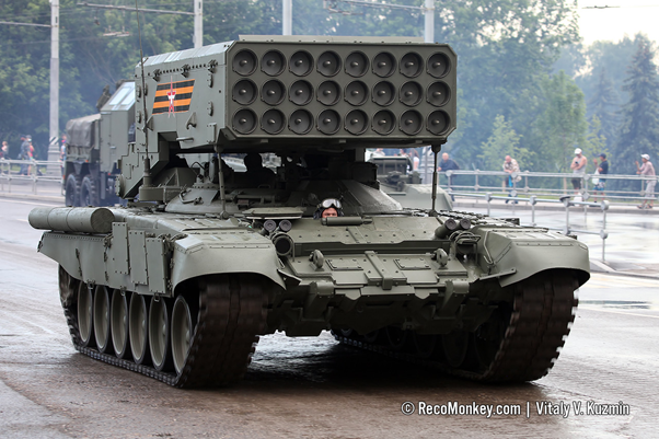 The famous TOS-1A ‘Solntsepek’. Not a flamethrower despite the translation, but an MRL firing 24x MO.1.01.04M 217kg, 3.7m long thermobaric rockets. Claimed to be capable of supressing a 40km2 area per vehicle salvo. Also has MO.1.01.04M.OP incendiary rockets