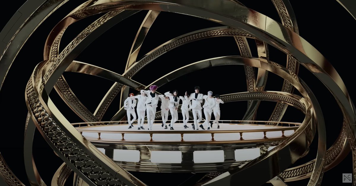 It ends with them, now together, in the circular platform moving to the center in sync with each other. The giant looping bracelets encircles them like a globe. Norse version of the Ouroboros myth; snake encircling the world. Hindu version, foundation of the Earth.