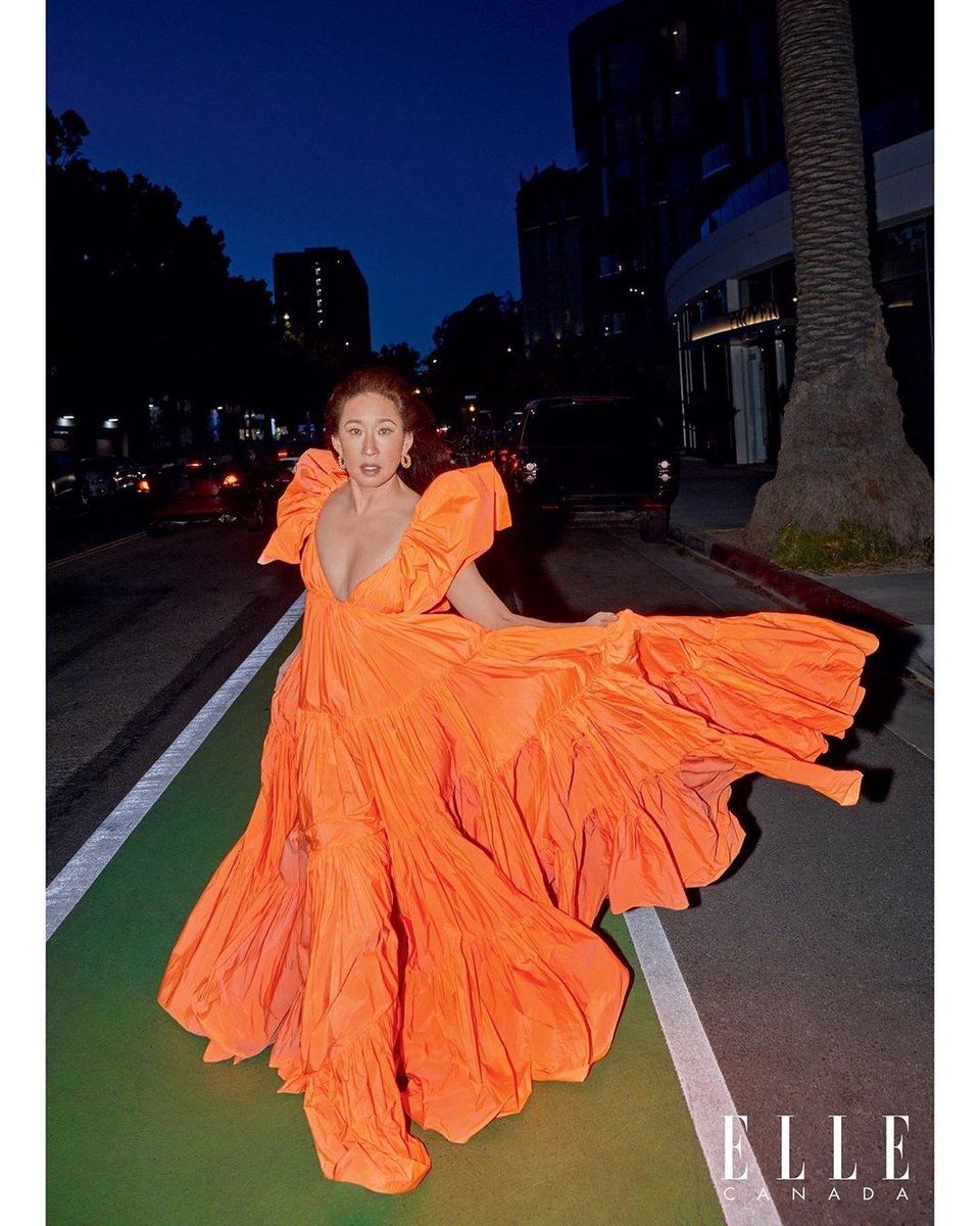 Actress #SandraOh was photographed by #GregSwales in an orange taffeta dress from #ValentinoSS20 for the June issue of #ElleCanada.