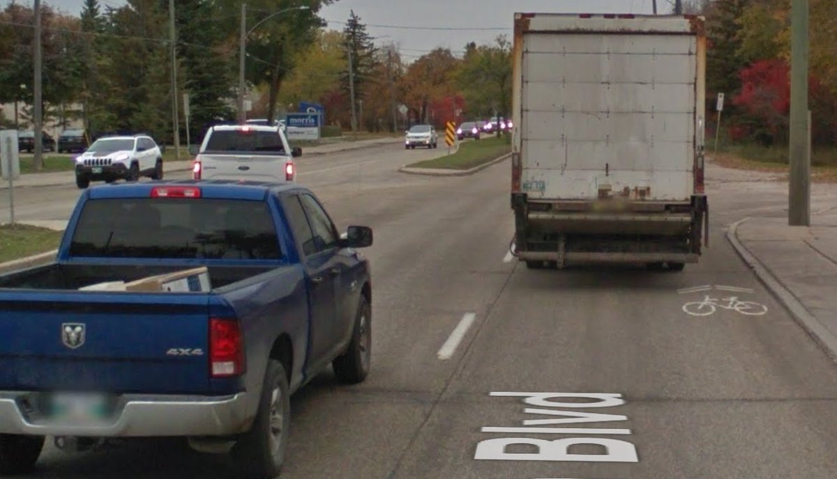 And why do cyclists feel uncomfortable using these "facilities?" Because here's the Roblin sharrow in action. I mean, who wouldn't want to take the kids out for a cruise along those 18 inches between the delivery truck and the curb? 6/