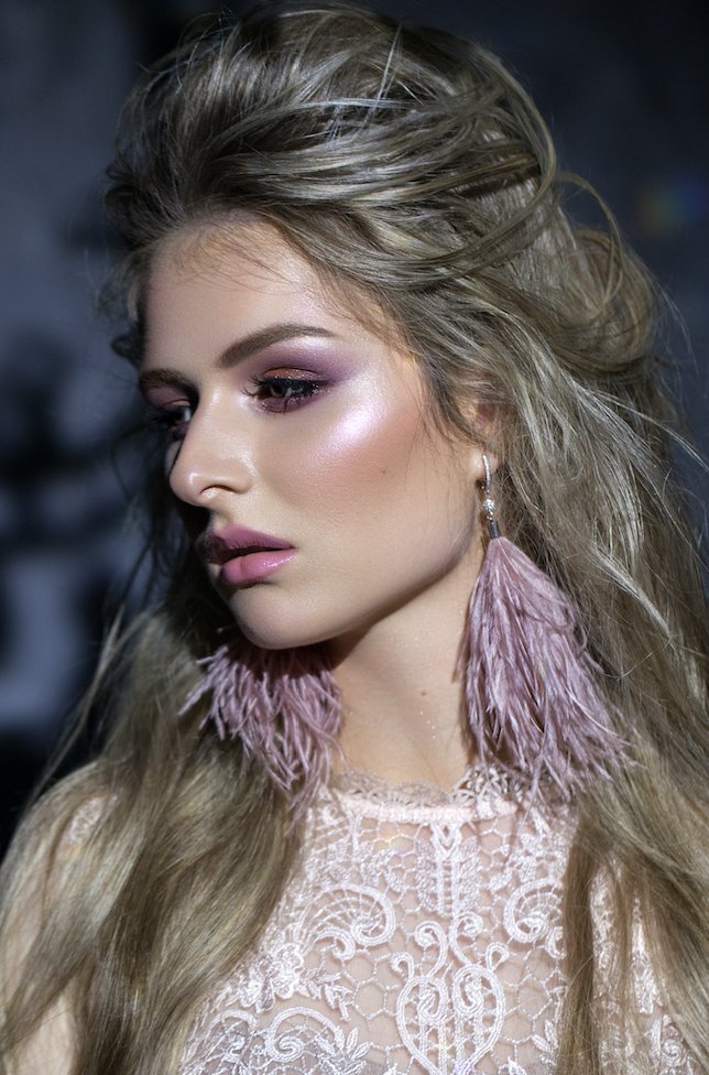 Accessories are like exclamation points of a woman’s outfit.

Enhance your outfit with ostrich feather earrings like these...