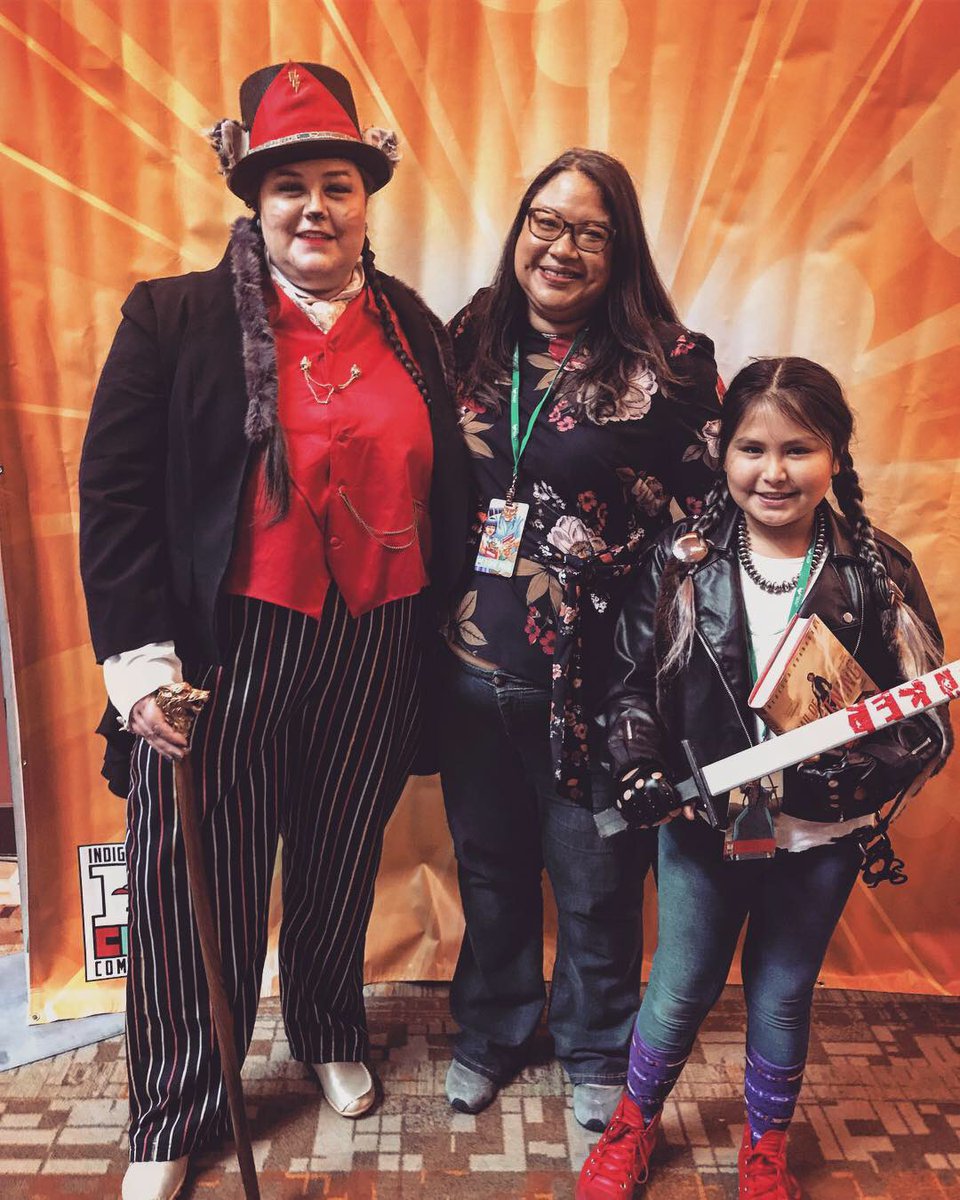 Here’s my kid & I cosplaying Ma’ii & Maggie from Rebecca Roanhorse’s (RR) “Trail of Lightning” at  @IndigenousCon in 2018. We devoured her book(s), not just bc it features badass Indigenous everything, but it’s a fabulously entertaining story worth all 5 Goodreads stars ;) +