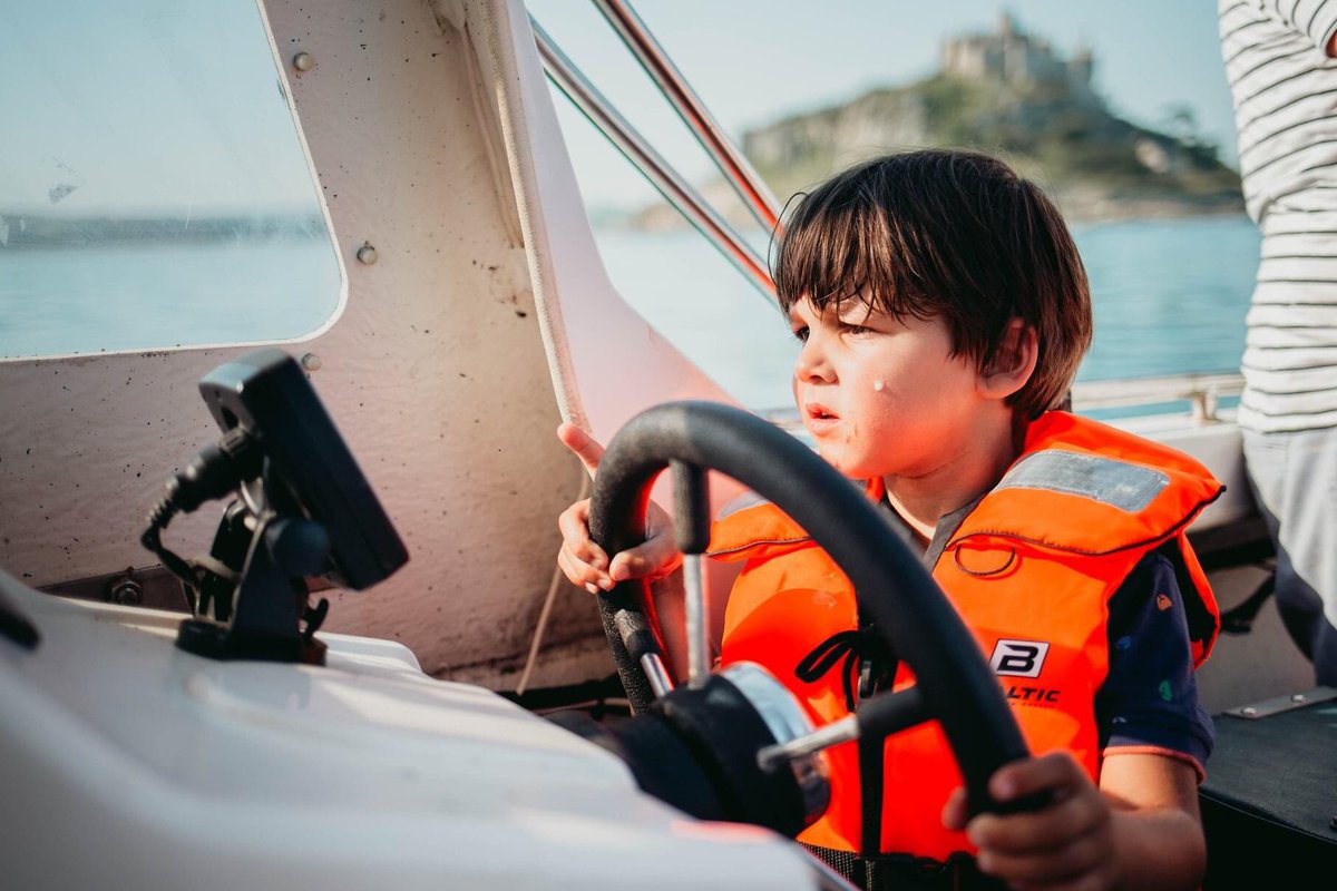 Beautiful night for boating last night! Arlo steered us around <a href="/ntmichaelsmount/">St Michael's Mount</a> like a pro!
