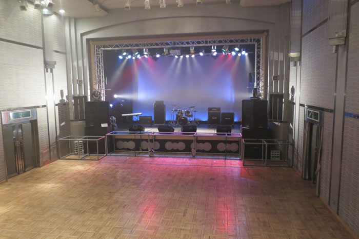 Live venues are called livehouses. They can be anything from a tiny underground space that barely holds 100 people, to whole halls that can fit thousands of fans. As expected, small bands start off in said tiny livehouses, which usually have bad ventilation and sound systems.