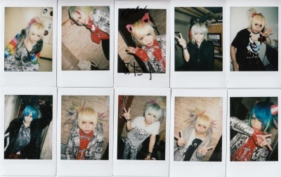 As for merch, bands usually make the most money from those! Common merch include チェキ (cheki, instant polaroid photos), muffler towels, and shirts. Cheki are highly valued, since they are all unique photos of the bandmen, but they are completely random.