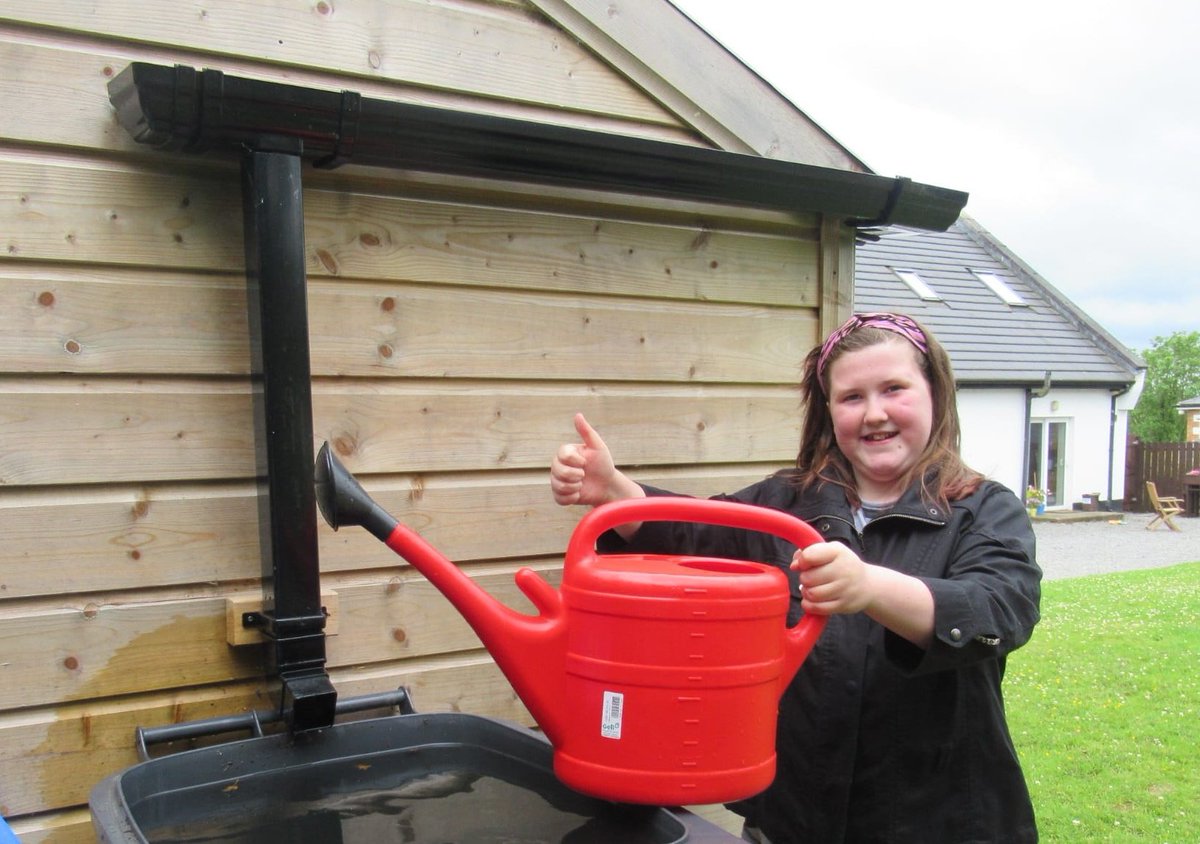 jojospartytime's tweet photo. My daughter Jayne watering our plants using water from a bin of collected rainwater that her Grandad installed. ☔ (The picture was taken by my son Christian who is part of @stpatscavangsc). 📸 Amazing prize! 

@greenschoolsire @official_irish_water #ConserveWater #GSCompetition https://t.co/ydfxy1ZXUB
