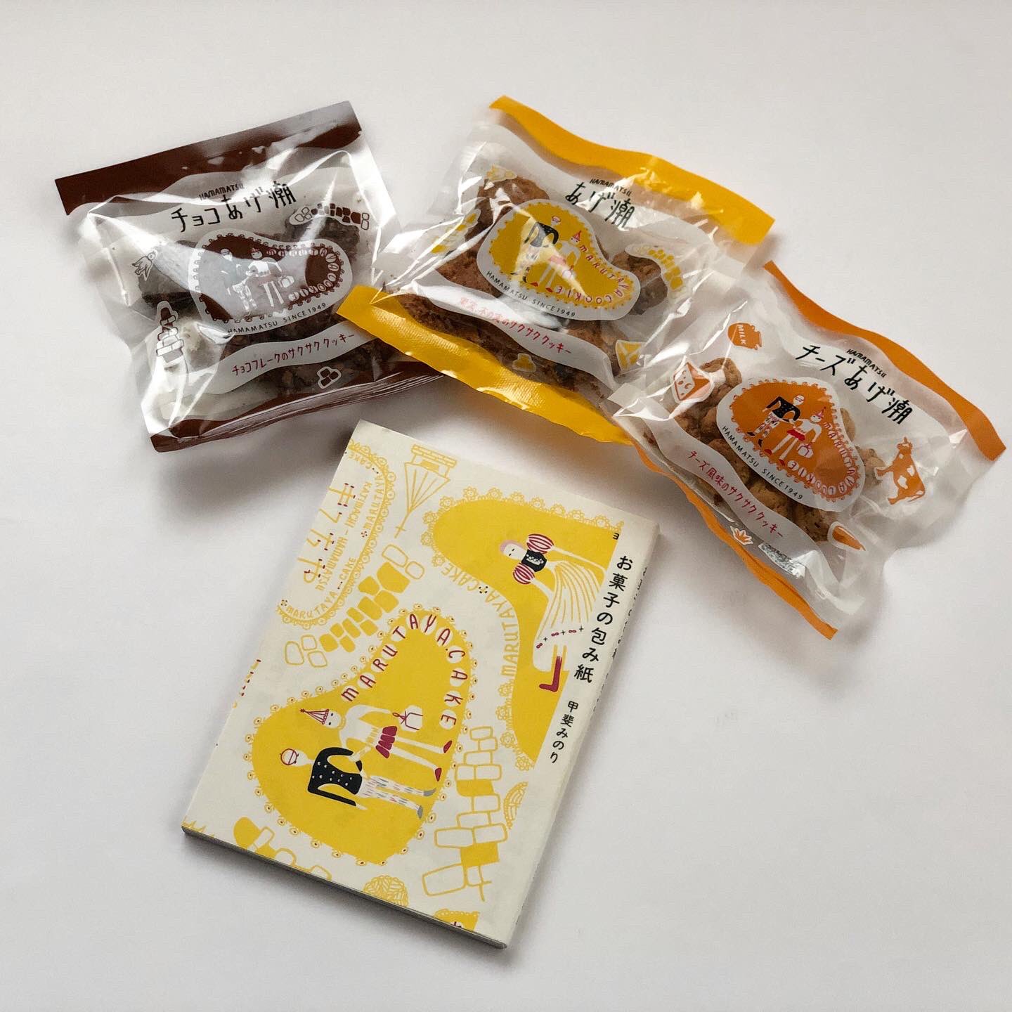 甲斐みのり ロルstaff お菓子の包み紙 の表紙に包装紙デザインを使用させていただいた静岡 まるたや の焼き菓子 あげ潮 チョコレートとチーズ味も仲間入り 東京オリンピックがあった1964年に発売されたチーズケーキの土台は特別配合のあげ潮です